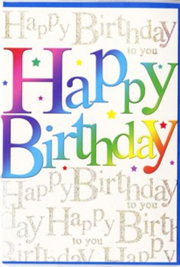 The image shows a joyful birthday card that feels as bright and contemporary as a walk through the Barbican's concrete terraces softened by blossoms and city greenery. Dominating the front are the words 'Happy Birthday,' written in large, confident letters that march across the card in a buttery-smooth gradient of colour. Each letter carries its own distinct hue-vivid crimson, royal purple, ocean blue, jade green, lemon yellow, and tangerine-yet they blend seamlessly where they meet, creating the sense of a painted rainbow gently brushed across the surface. The lettering style is clean and modern, with rounded edges that give the words a friendly, approachable look, almost like cheerful signage in a gallery foyer near the Barbican Estate. Behind this, the background is a soft, light tone, densely overlaid with delicate golden script that repeats 'Happy Birthday to you' in a graceful, cursive rhythm. The gold looks slightly raised and glitter-kissed, suggesting a subtle texture beneath the fingers, catching light in the same way evening sun glints off the nearby high-rise windows. Here and there, fine specks and star-like details in complementary colours add a celebratory sparkle, evoking confetti floating to the ground at the end of a party. The card's finish appears satin-smooth, with a gentle sheen that enhances the interplay between the bold rainbow lettering and the elegant gold script. It feels perfectly suited to accompany a colourful bouquet ordered in the Barbican area, perhaps for delivery to a birthday lunch at a local restaurant or to brighten a desk in one of the nearby offices. The overall impression is one of honest joy and thoughtful design-a card meant to make someone smile the moment it's lifted from its envelope.